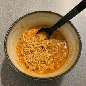 Fiery Chicken Ramen infused with a creamy garlic sauce Recipe